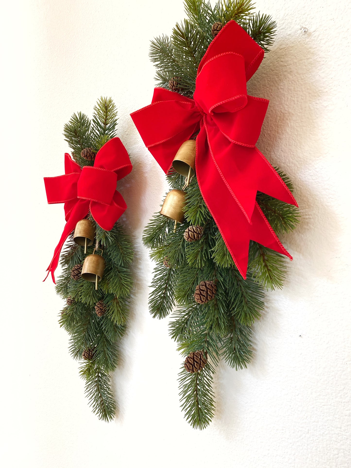 Christmas Door Swag Classic - Real Touch Pine with 2 Brass Bells, Sequoia Pine Cones and red Velvet Bow
