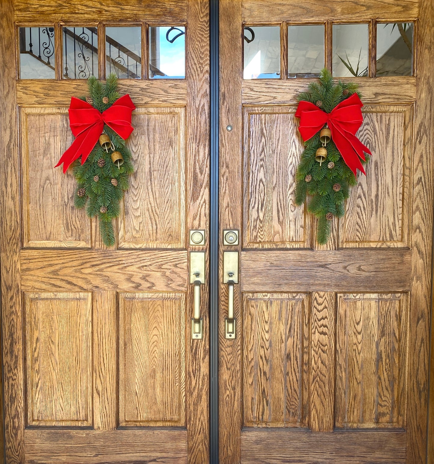 Christmas Door Swag Classic - Real Touch Pine with 2 Brass Bells, Sequoia Pine Cones and red Velvet Bow